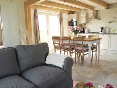 The dinner table and kitchen