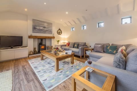 Greyseals, Brancaster: Sitting room with wood burning stove