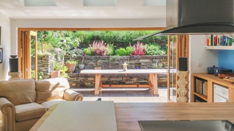 Huge kitchen/dining/entertainiing room leading onto terraces front and back