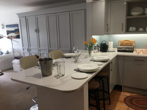 White bone china dinner service for 6, stone work surfaces