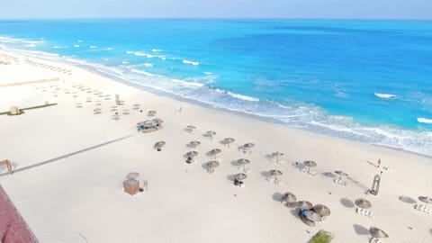 On the beach, free beach shuttle, sun loungers, beach umbrellas