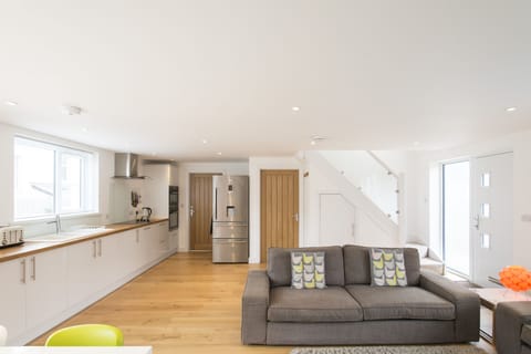 Kitchen with wooden work tops and big family fridge