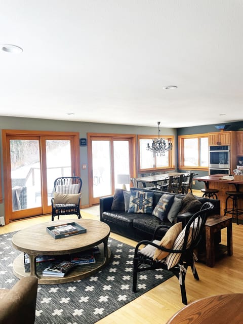 Oversized Restoration Hardware table and deep leather couch