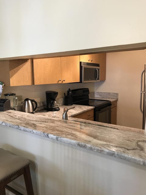 Glass top stove with above range microwave. 