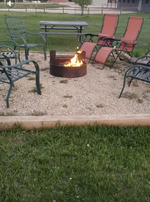 The community firepit is located toward the front of the property.