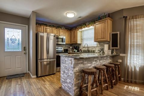 Smoky Mountain Vacation Rental "Striking Waters" - Bar top and kitchen