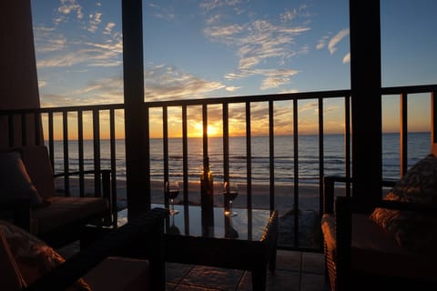 Relax with a  glass of wine while the sun sets over Indian Rocks Beach