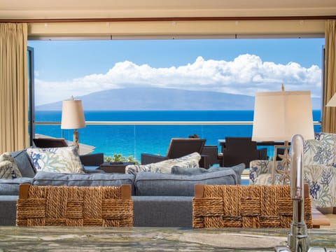 Soak in panoramic views of the Pacific from the comfort of the living room, with floor-to-ceiling windows that bring the beauty of Maui indoors.