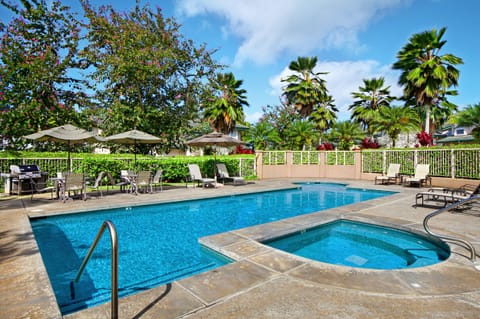 Unwind at the Villas of Kamalii community pool and hot tub, the perfect spot to soak up the Hawaii sun.