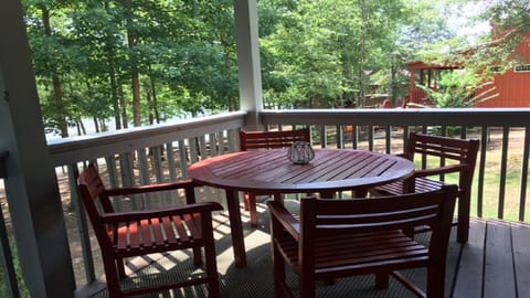 Outdoor Dining Table and chairs on deck toward Lake