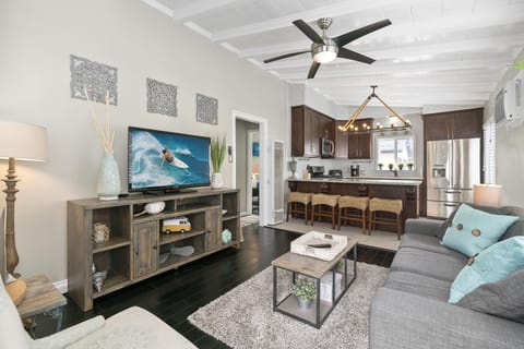 View of main living spaces from the front Dutch door entry. Open floor plan between living, kitchen and eating areas.
                