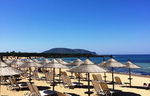 Beach nearby, white sand, sun loungers, beach umbrellas