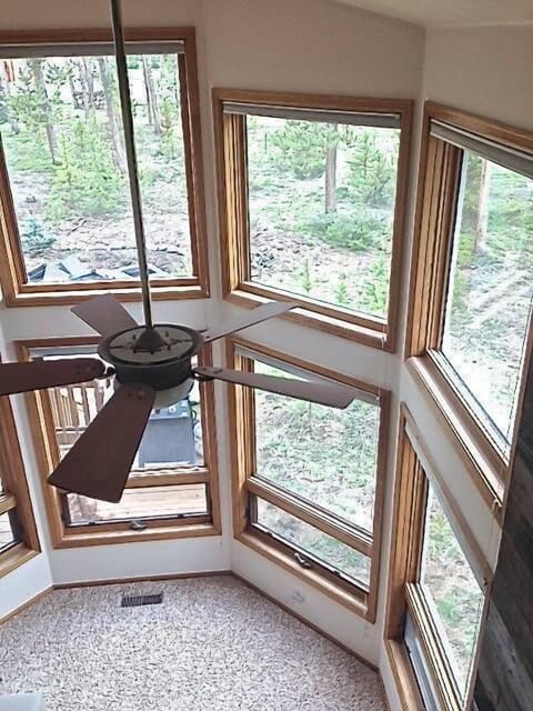 view down to the living room from 3rd floor lofted room