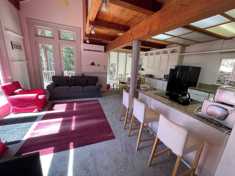 Living room and partial view of kitchen.