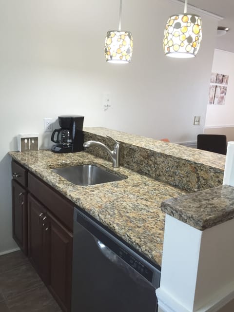 Granite Counters & new cabinets with  stainless accents