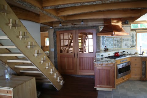 Hand crafted pegged stairway leads you to the second floor bedrooms and TV room.