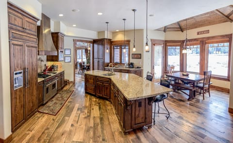 Fully stocked gourmet kitchen,wolf stove ,nook looking out to yard /golf course