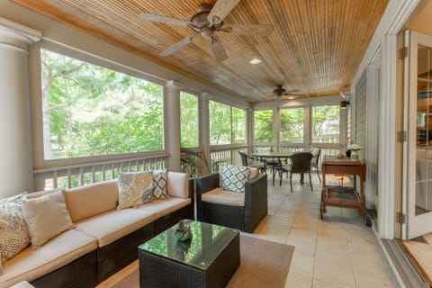 Huge Rear Screened Porch with Plenty of Seating and Beautiful Water Views.