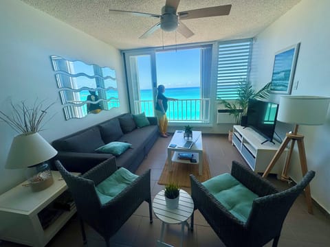Spacious living room with sofa that turns into double size bed.