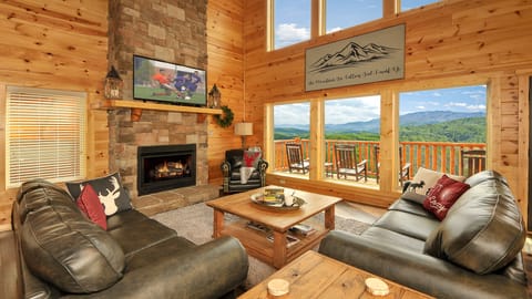 Enjoy the views and the 27' high stacked-stone gas fireplace w/wall of windows