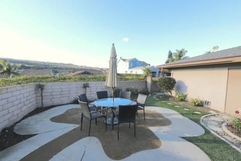 Enjoy this gorgeous view and this outdoor sitting area in the private backyard