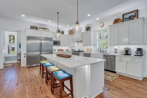 Open kitchen with island seating for four