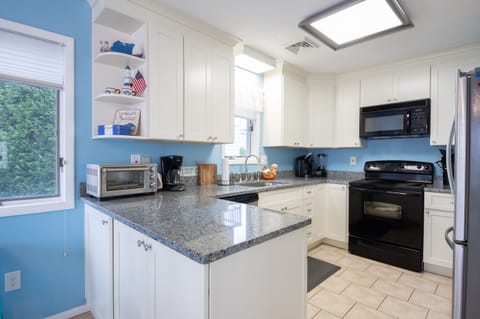 Kitchen was updated in 2019. Repainted 2023 to lighter blue than seen here