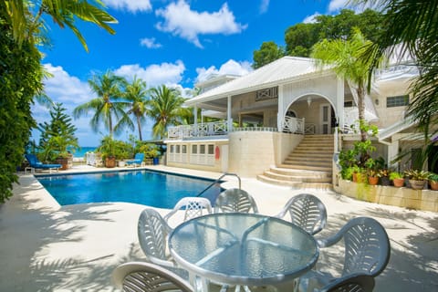 View of the pool and entrance steps looking towards the sea. 