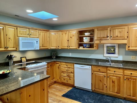 Meals are a breeze with a well-stocked kitchen, granite countertops, Keurig.