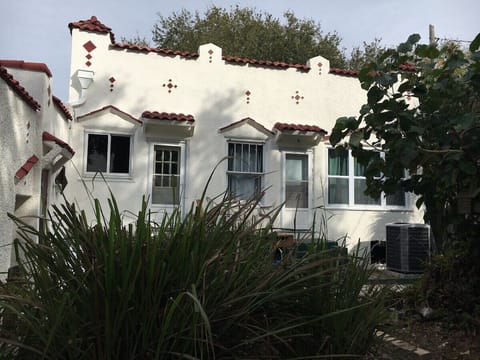 Back of house where entrance to unit is - right door enters living area, left door enters kitchen