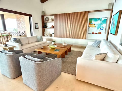 Living Room with 80" TV behind cabinet door