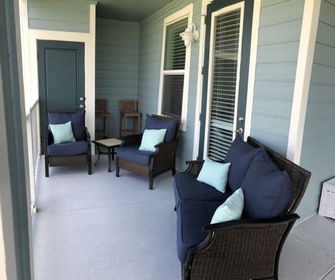 Comfortable new seating on the back patio overlooks the bay.