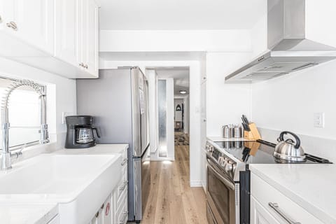 The kitchen comes stocked with dishes, utensils, cookware, bakeware, and all major and small appliances.