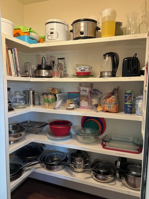 Well stocked pantry. Middle shelf to stock your own food.