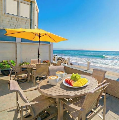 Enjoy morning coffee while watching surfers at "Little Windan Sea" surf break