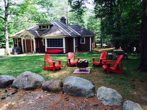 Inviting view of Juniper Cottage. Wooded seclusion yet short walk to village.