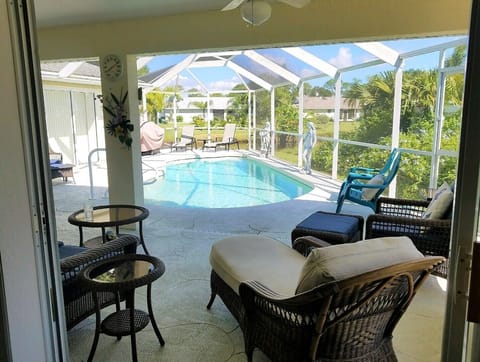 Relax on chaise lounge poolside on canal enjoying the native birds/ wildlife.