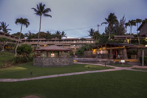 Twilight view of Kahana Sunset from beach - large grassy area, bbq and pools