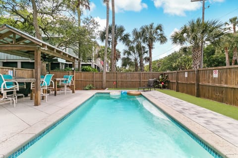 Take a refreshing dip in the sparkling pool surrounded by swaying palms and coastal breezes