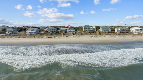 Beachfront property location with direct ocean access and pristine sandy shores.