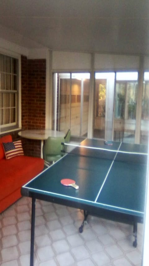 Four seasons ping pong game room with CB2 couch