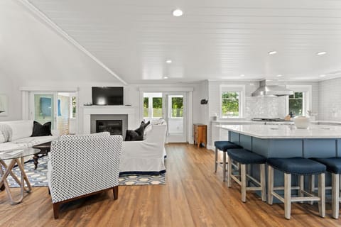 Inside you'll find an open concept with chef inspired kitchen, living area, wet bar and dining room.