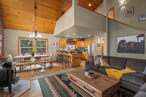 Settle into this open-concept sanctuary where soaring wood ceilings and natural light create the perfect mountain retreat atmosphere.