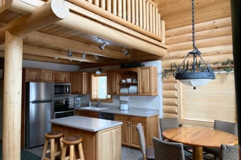 Fully equipped kitchen with essentials, including a refrigerator, stove, oven, microwave, and dishwasher.