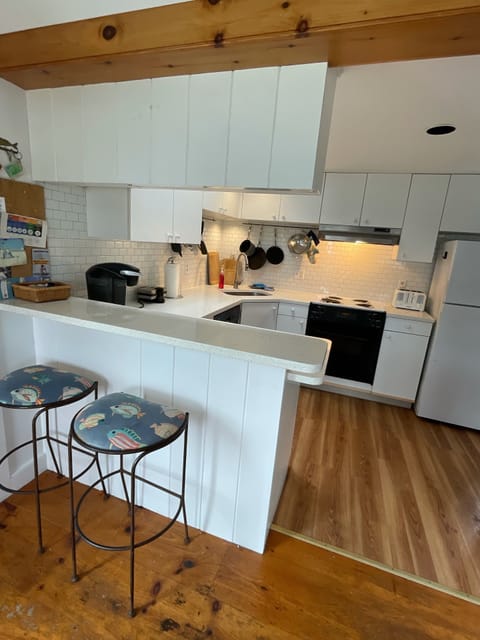 Open kitchen fully equipped for dining in