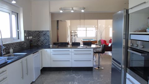 spacious kitchen that leads to the open living area