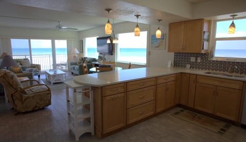 Overlook of kitchen, dining area, and living room