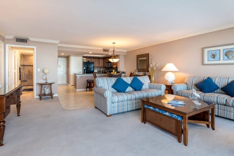 Large living area w 2-full-size couches, end and cocktail tables & side lamps.
