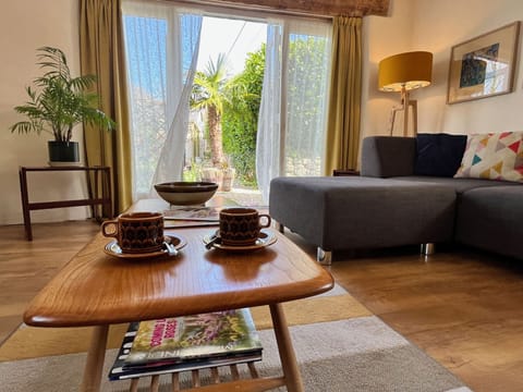 Spacious open plan living area with patio doors.