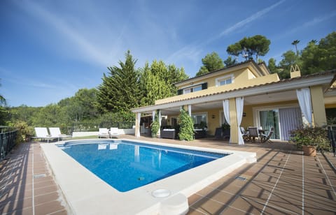 View of the house with the porch and pool